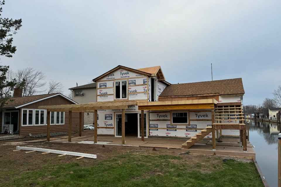 Before: second storey addition framed and house-wrapped during construction by Kuiper Construction
